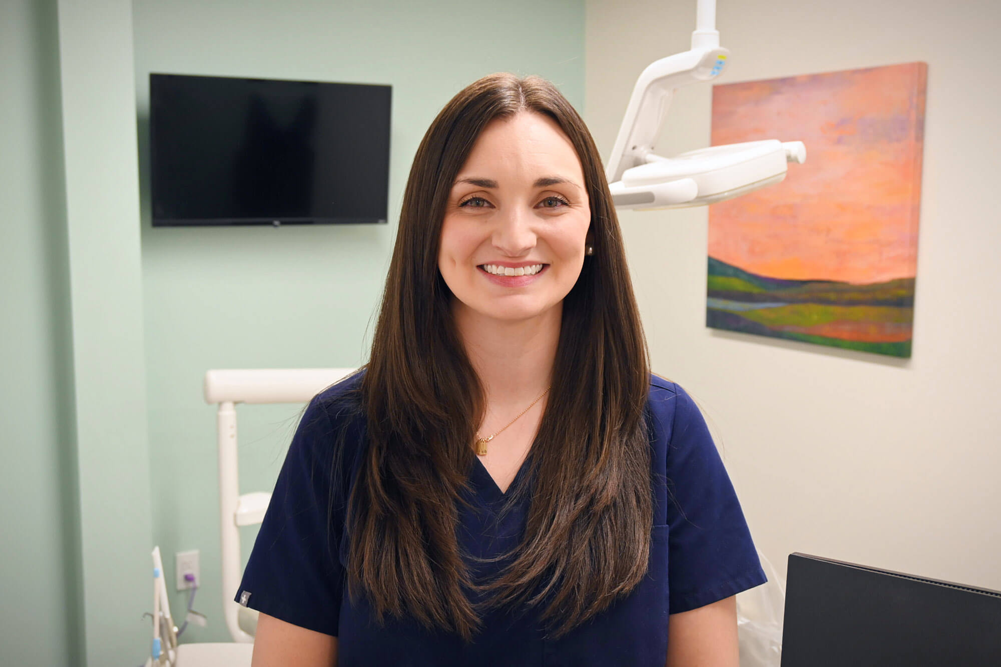 Dr. Allison Norton smiling, in the clinic, for her headshot.