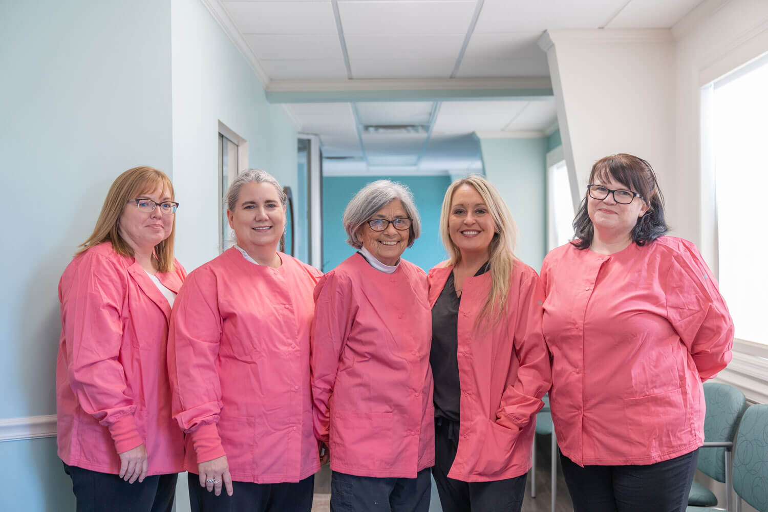 A team member posting for a headshot image